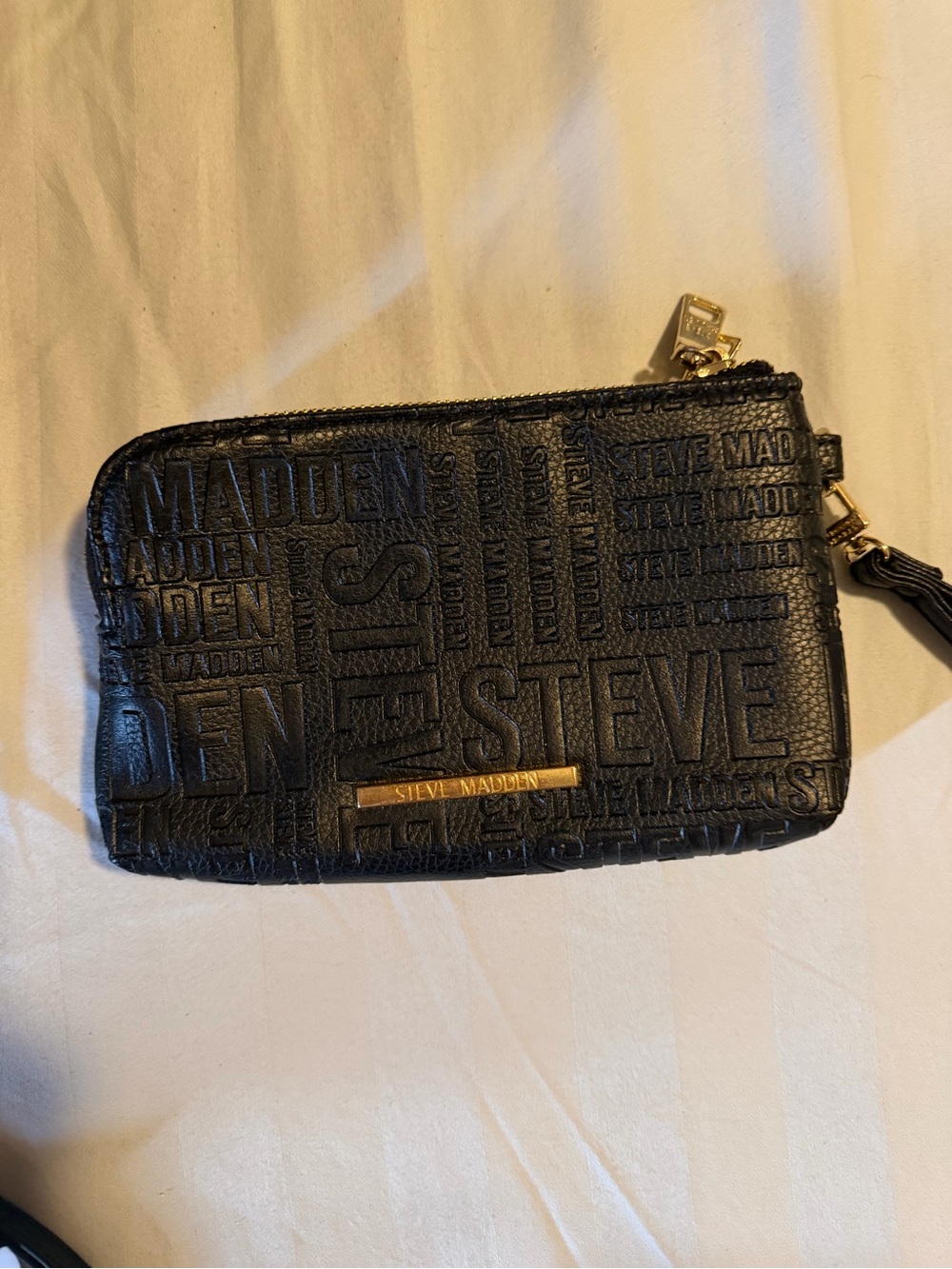 Steve Madden Black Embossed Logo Wristlet with Gold Accent